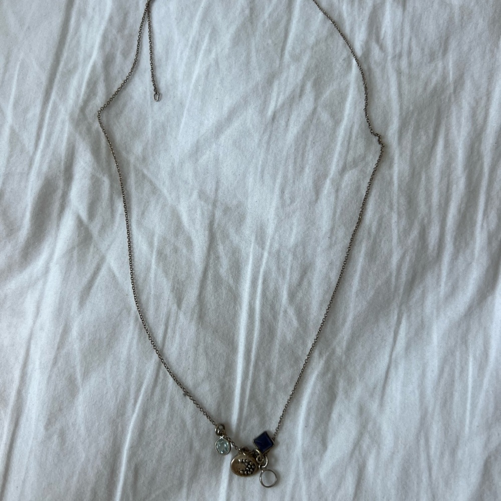 Sterling silver necklace with several charms